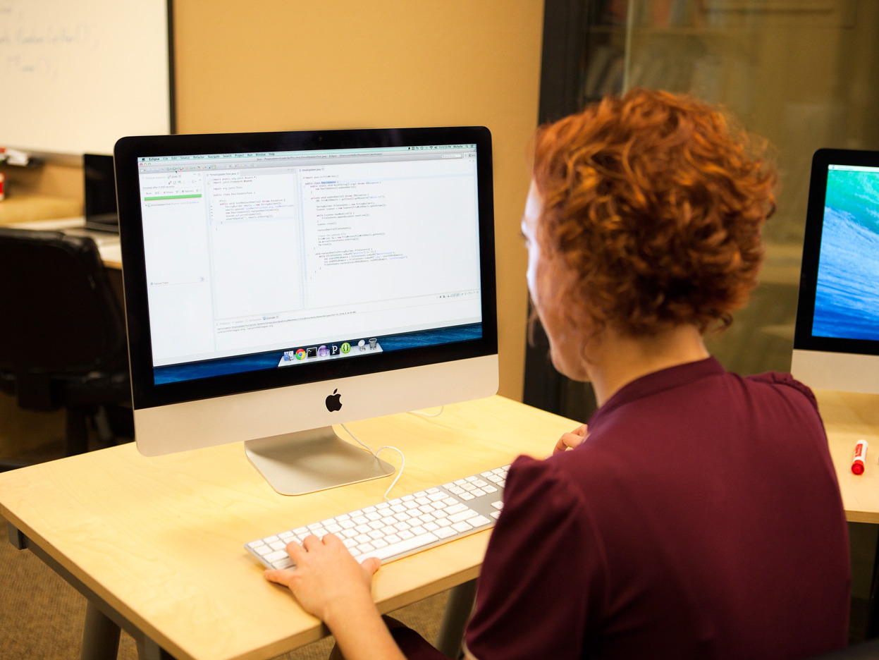 A software engineer using software to build new software